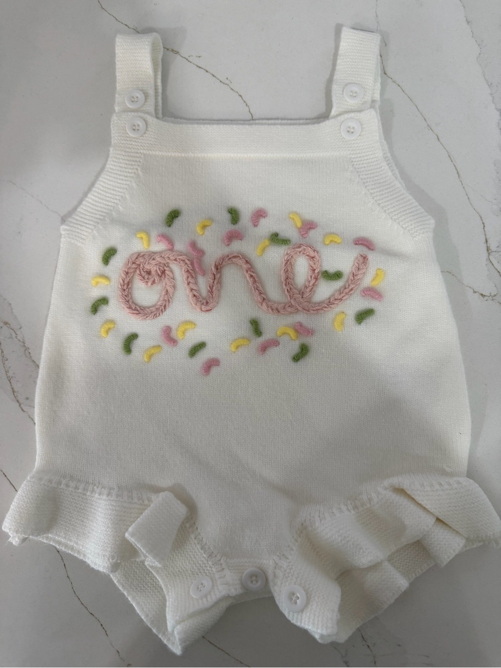 First Birthday White Knit Baby Romper with Pink Script & Pastel Confetti